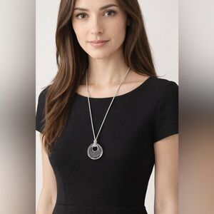 JJ unique lucite circular pendant attached to a grey adjustable cord 🤍🩶